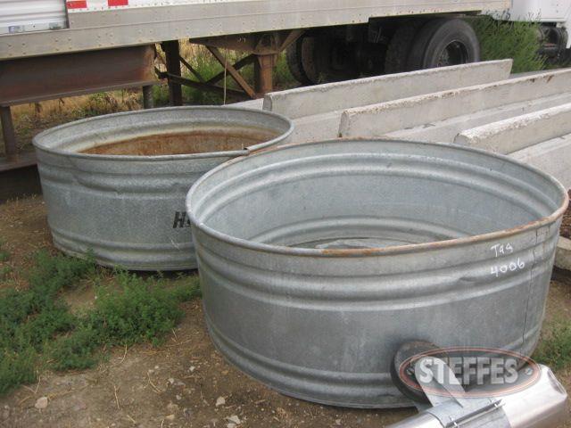 (2) galvanized round water troughs